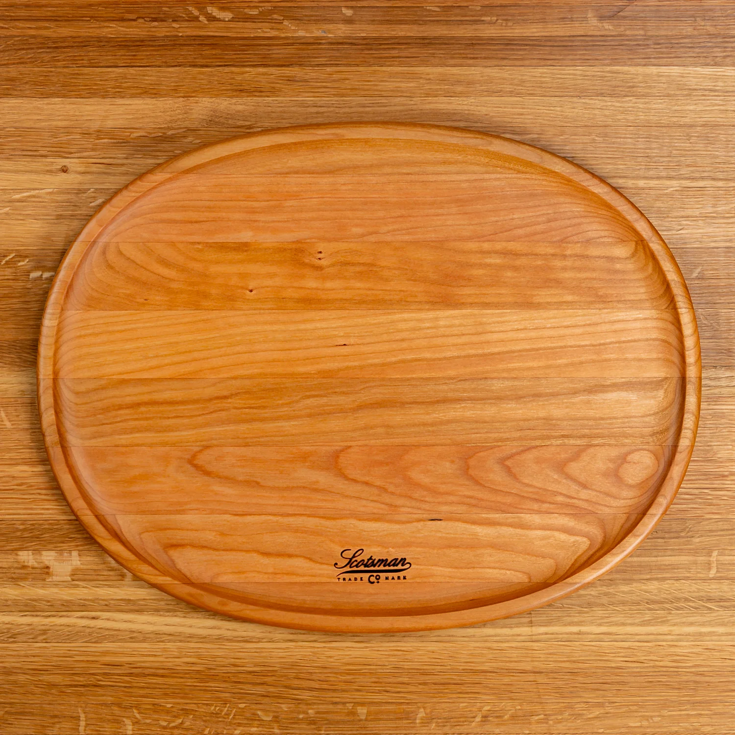 204-cherry-oval-carving-board-1.webp