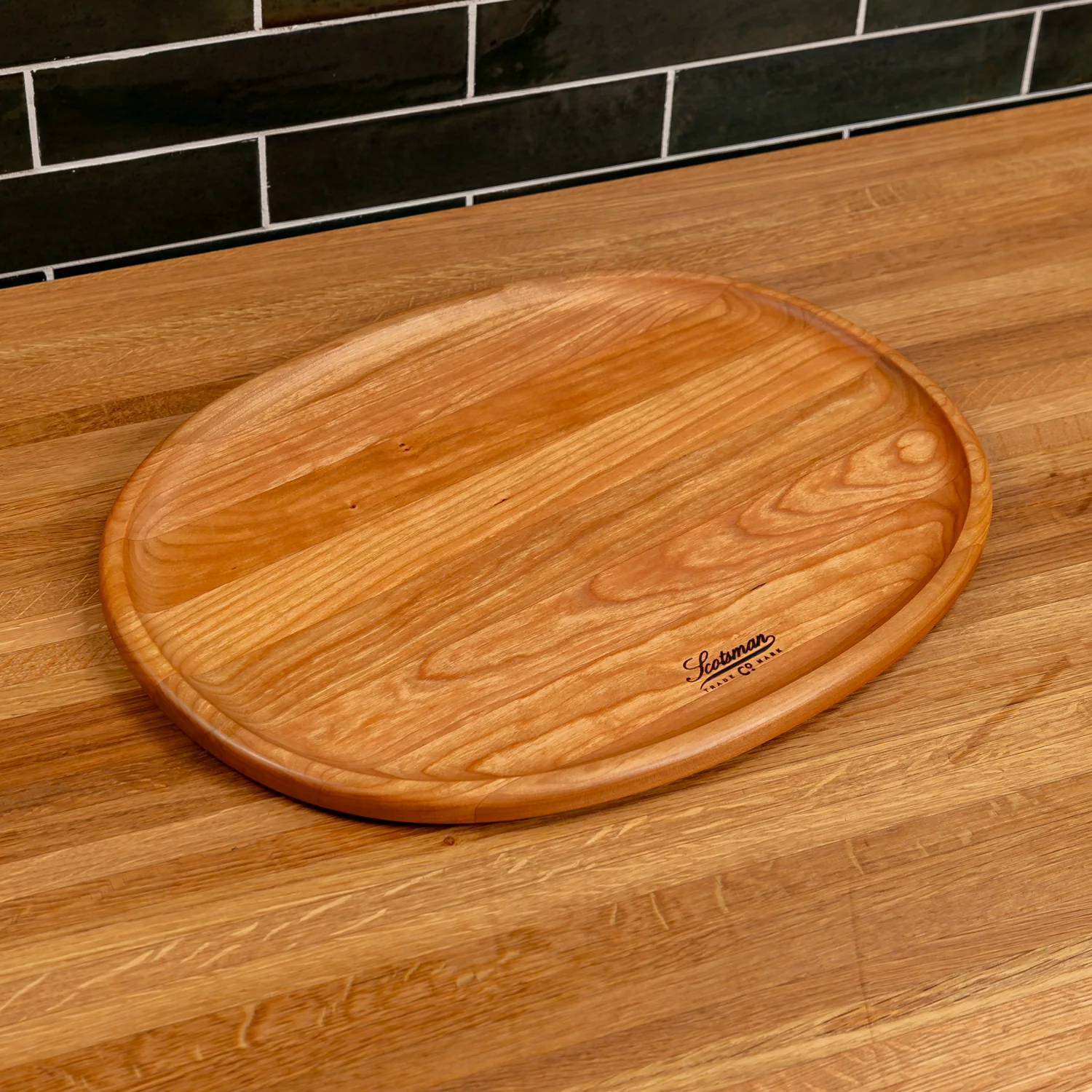 204-cherry-oval-carving-board-1.webp