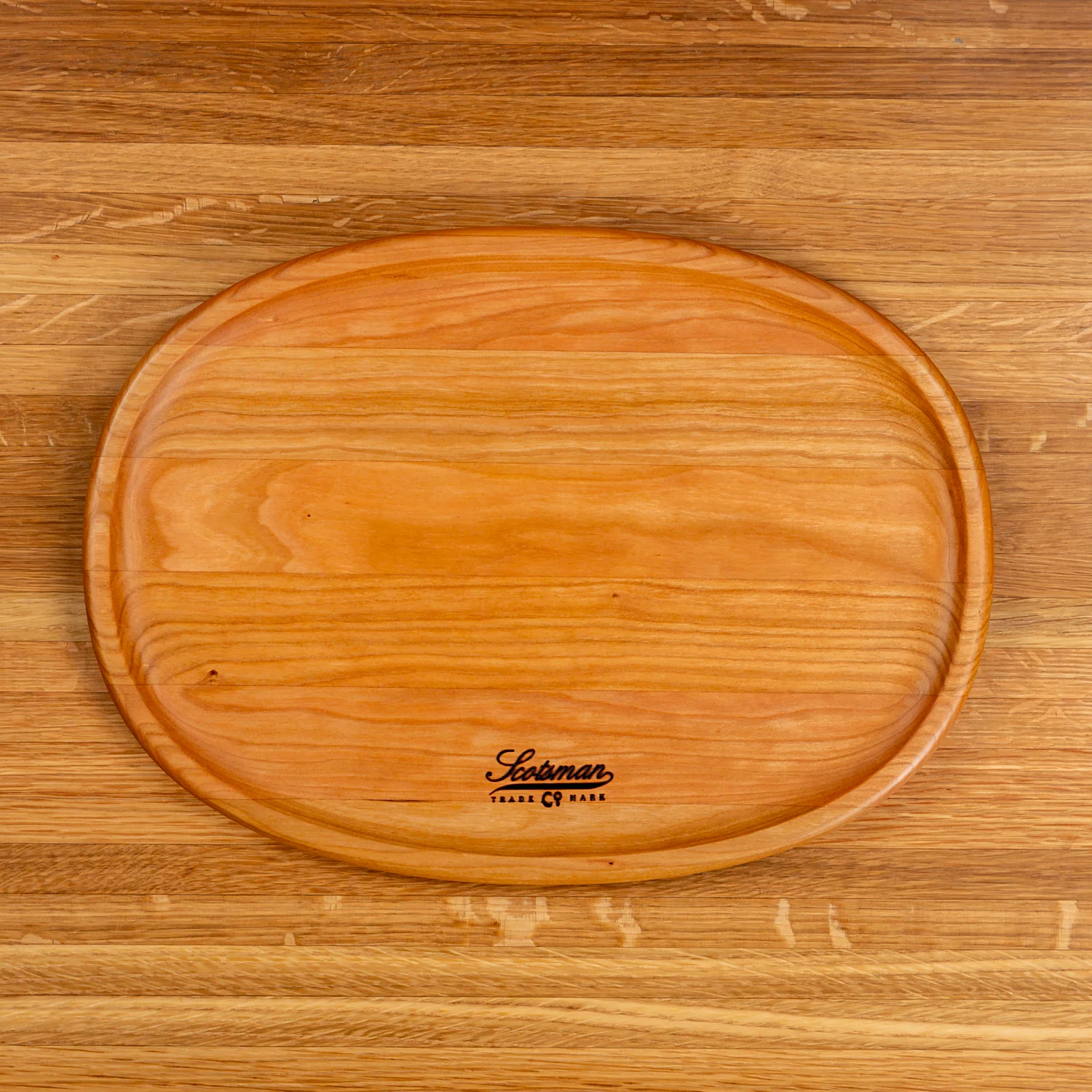 204-cherry-oval-carving-board-1.webp