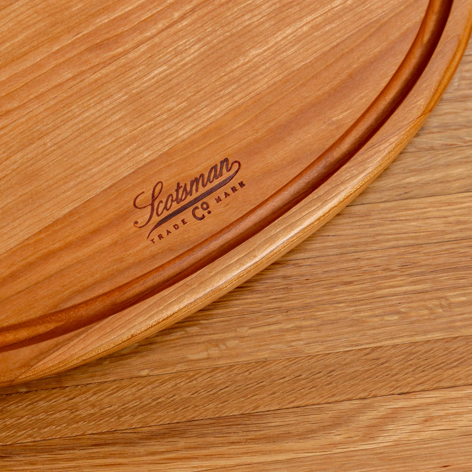 508-cherry-oval-serving-board-with-juice-groove-1.webp