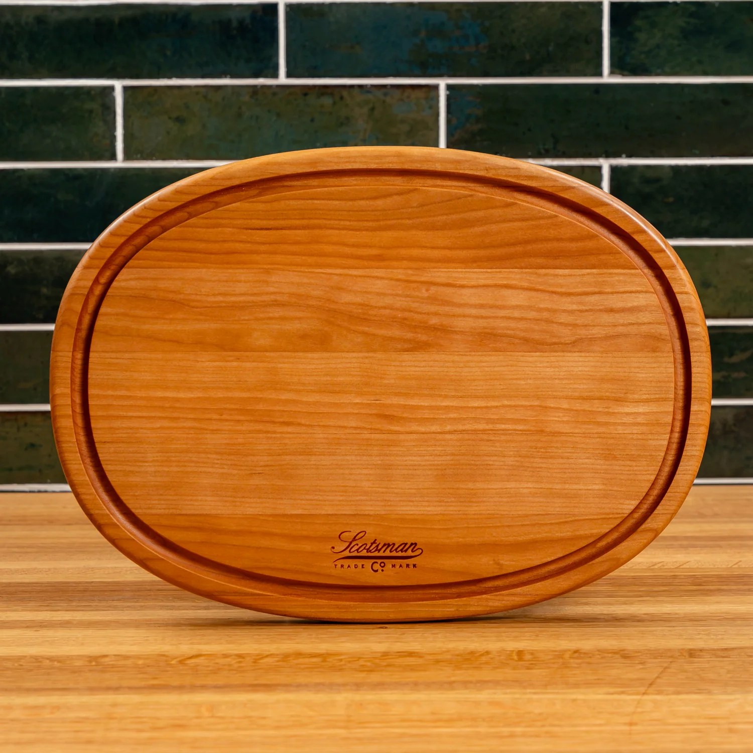 508-cherry-oval-serving-board-with-juice-groove-1.webp