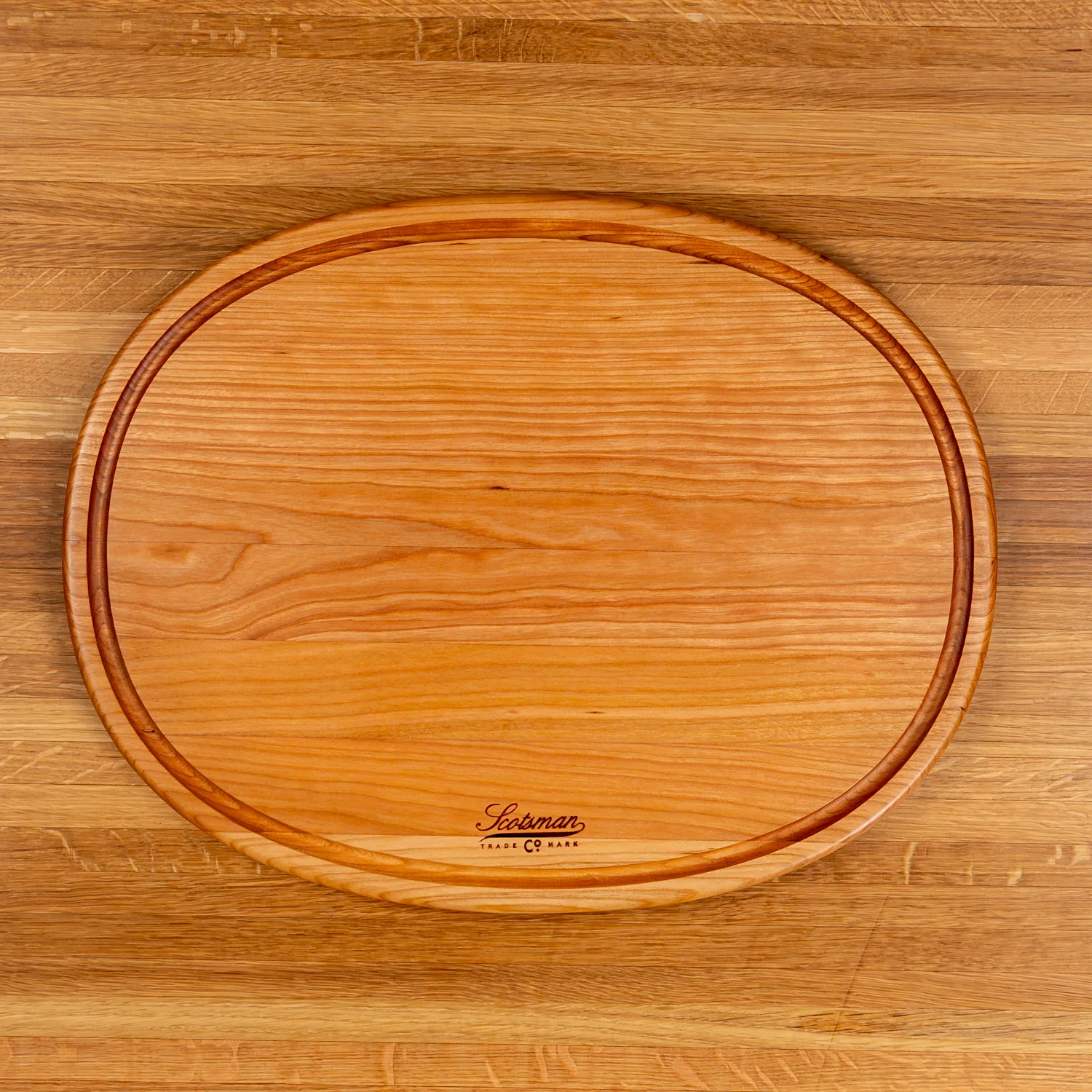 508-cherry-oval-serving-board-with-juice-groove-1.webp