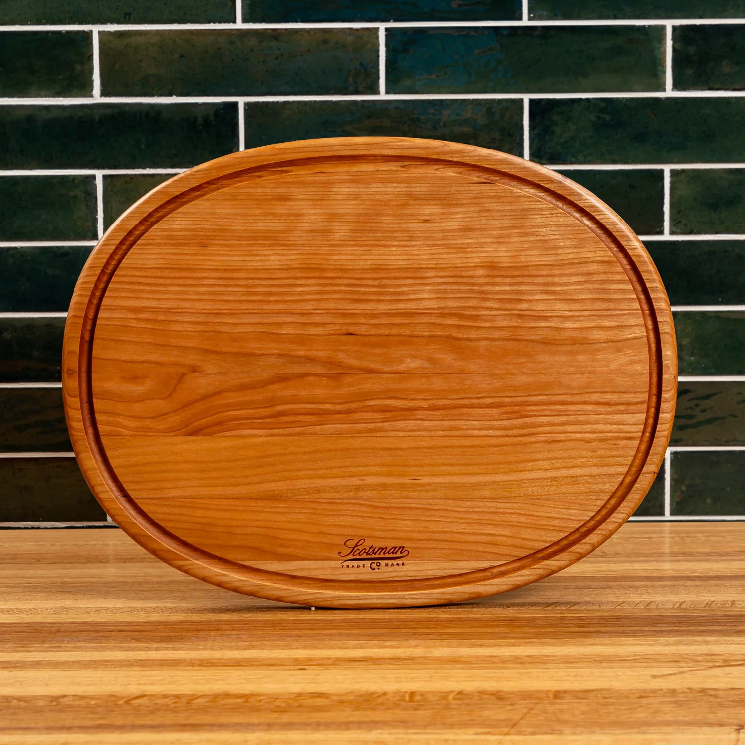508-cherry-oval-serving-board-with-juice-groove-1.webp