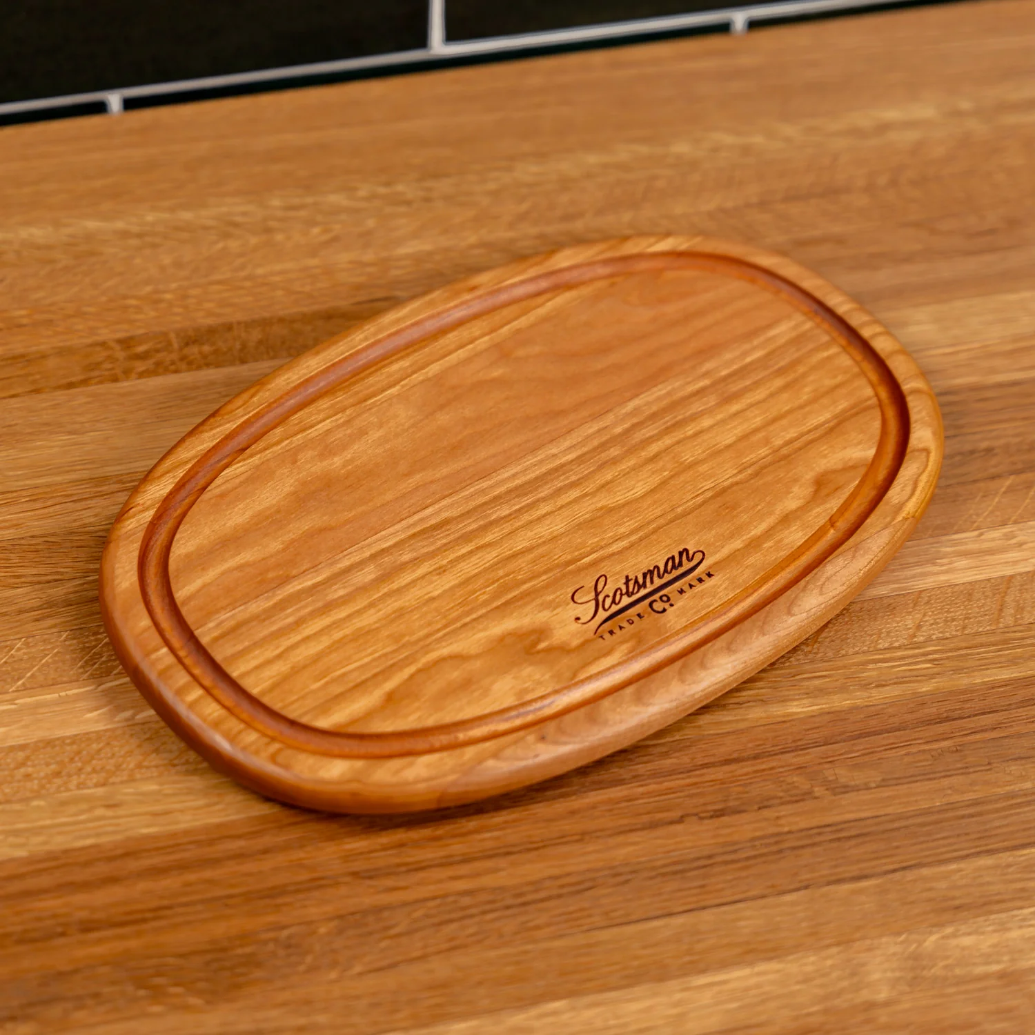 508-cherry-oval-serving-board-with-juice-groove-1.webp