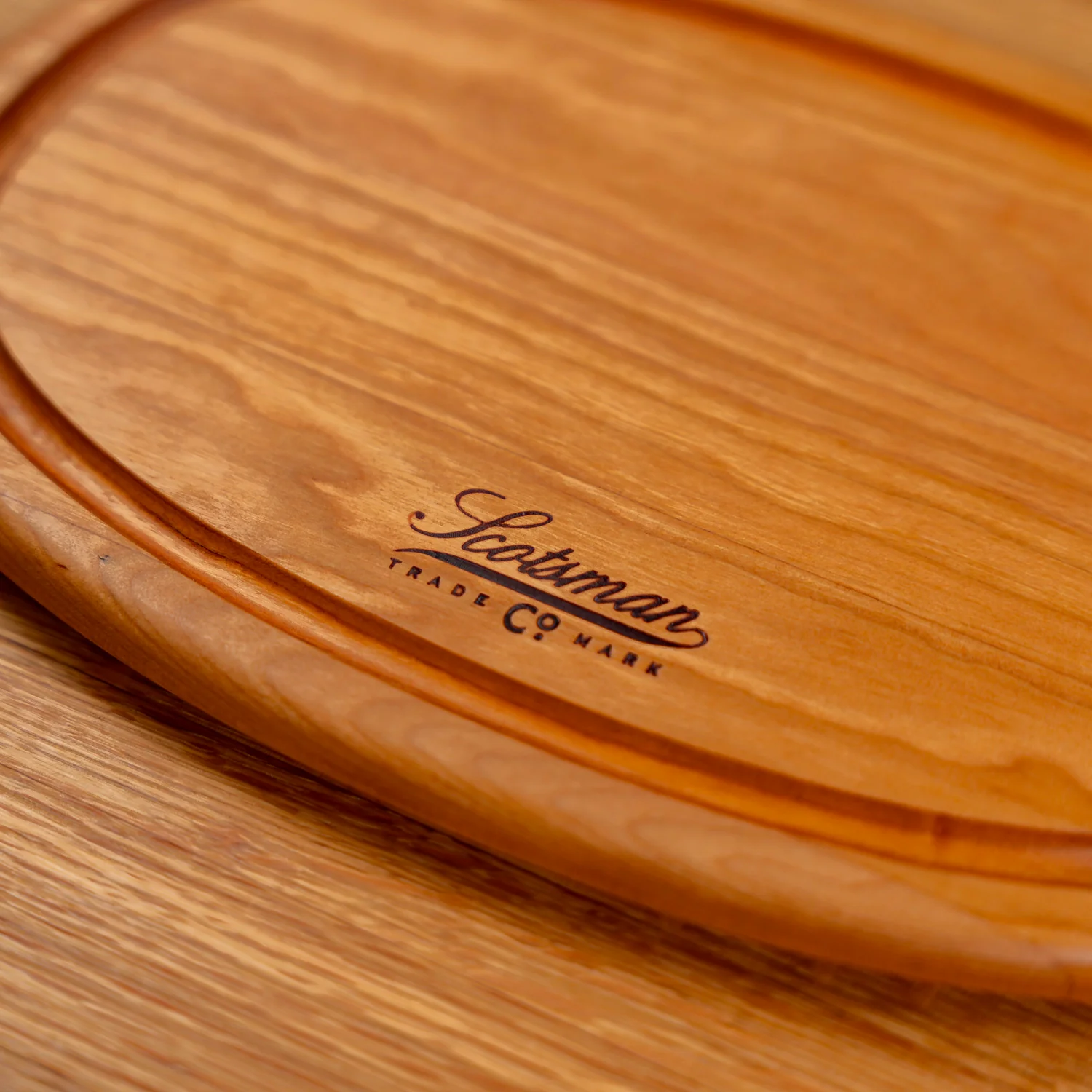 508-cherry-oval-serving-board-with-juice-groove-1.webp