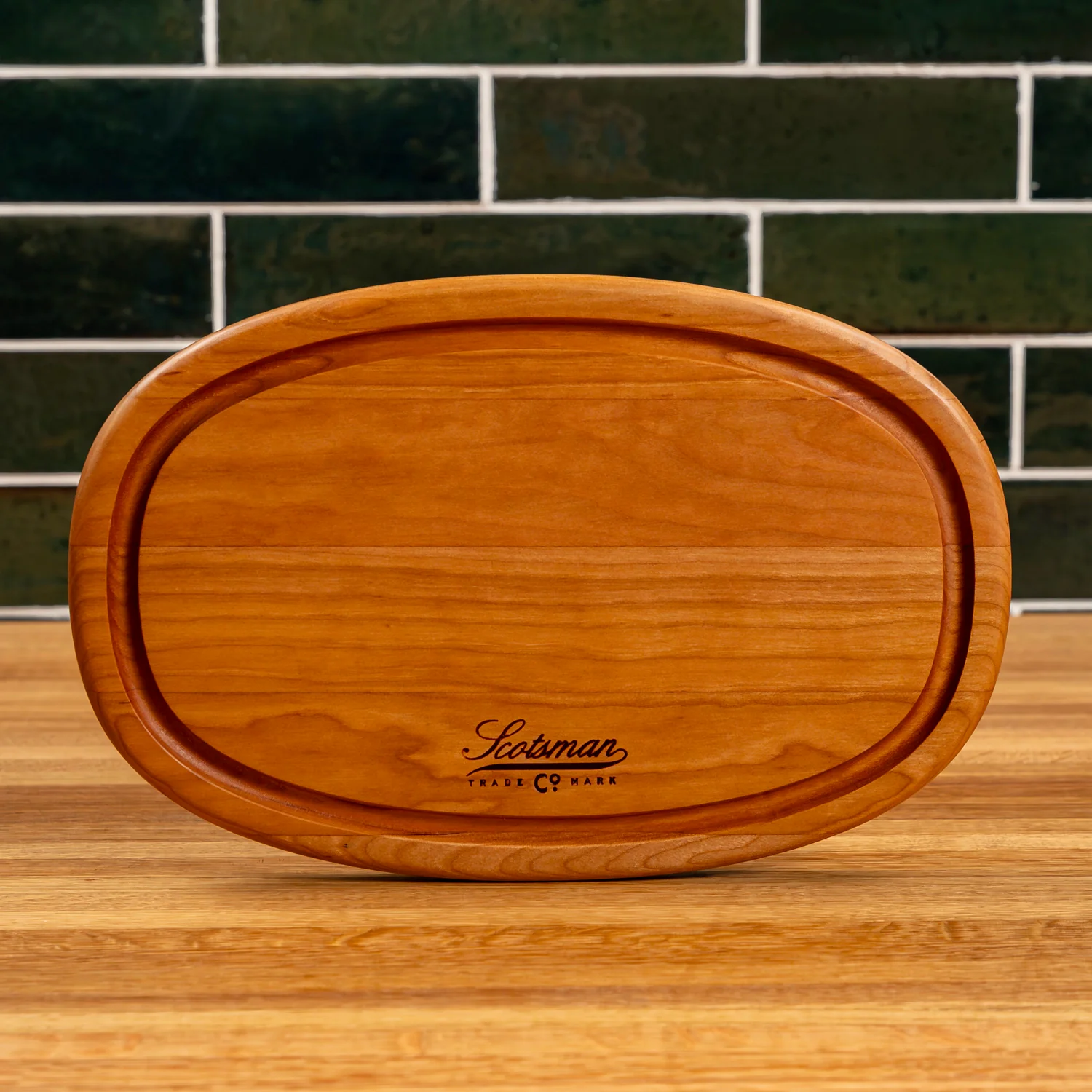 508-cherry-oval-serving-board-with-juice-groove-1.webp