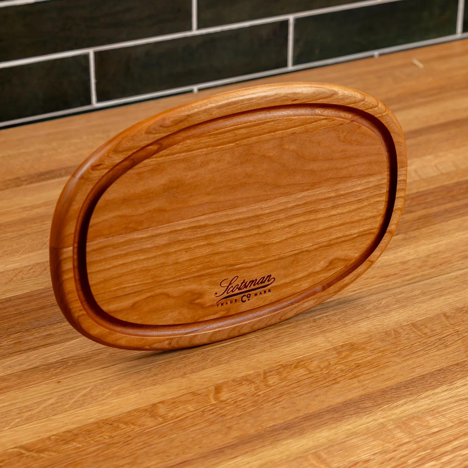 508-cherry-oval-serving-board-with-juice-groove-1.webp
