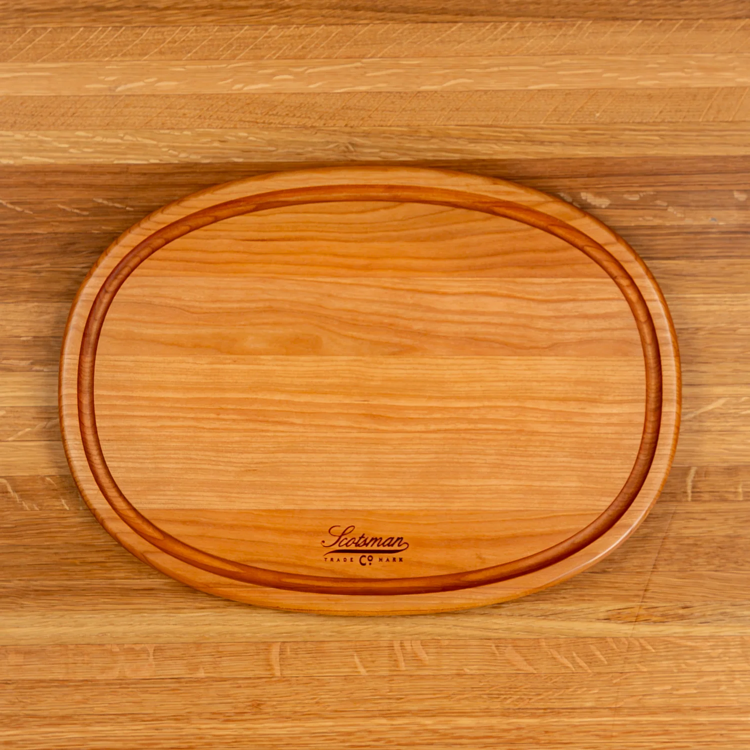 508-cherry-oval-serving-board-with-juice-groove-1.webp