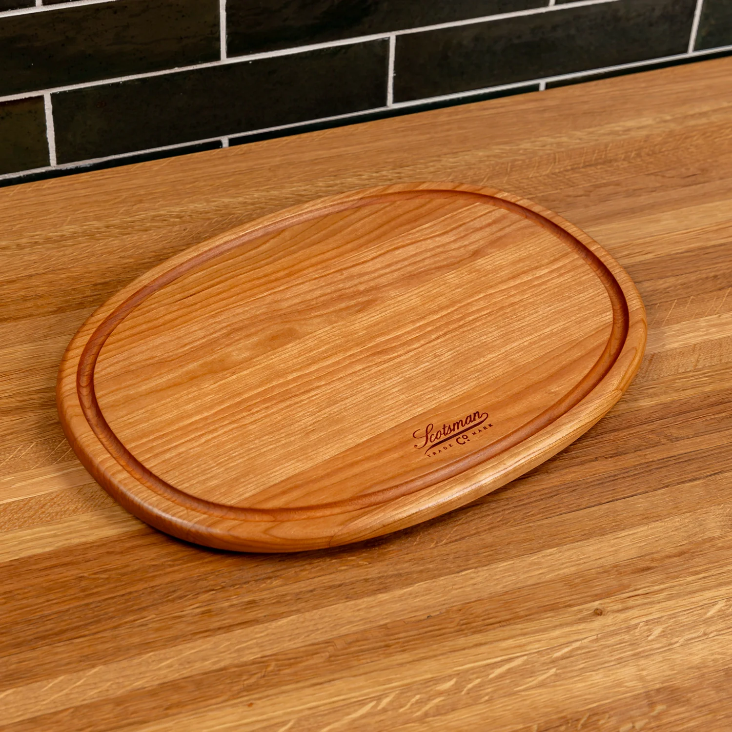 508-cherry-oval-serving-board-with-juice-groove-1.webp